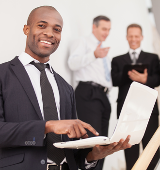 Businessman Holding a Laptop