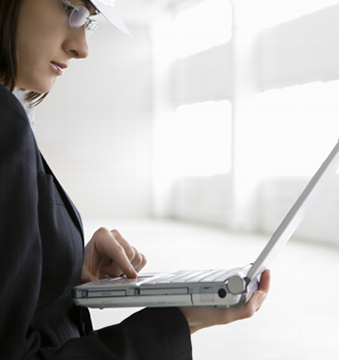 Woman Holding A Laptop